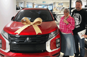 Red Mitsubishi ASX Red Plum Automotive Car Buying Service Testimonial Happy New Car Owners